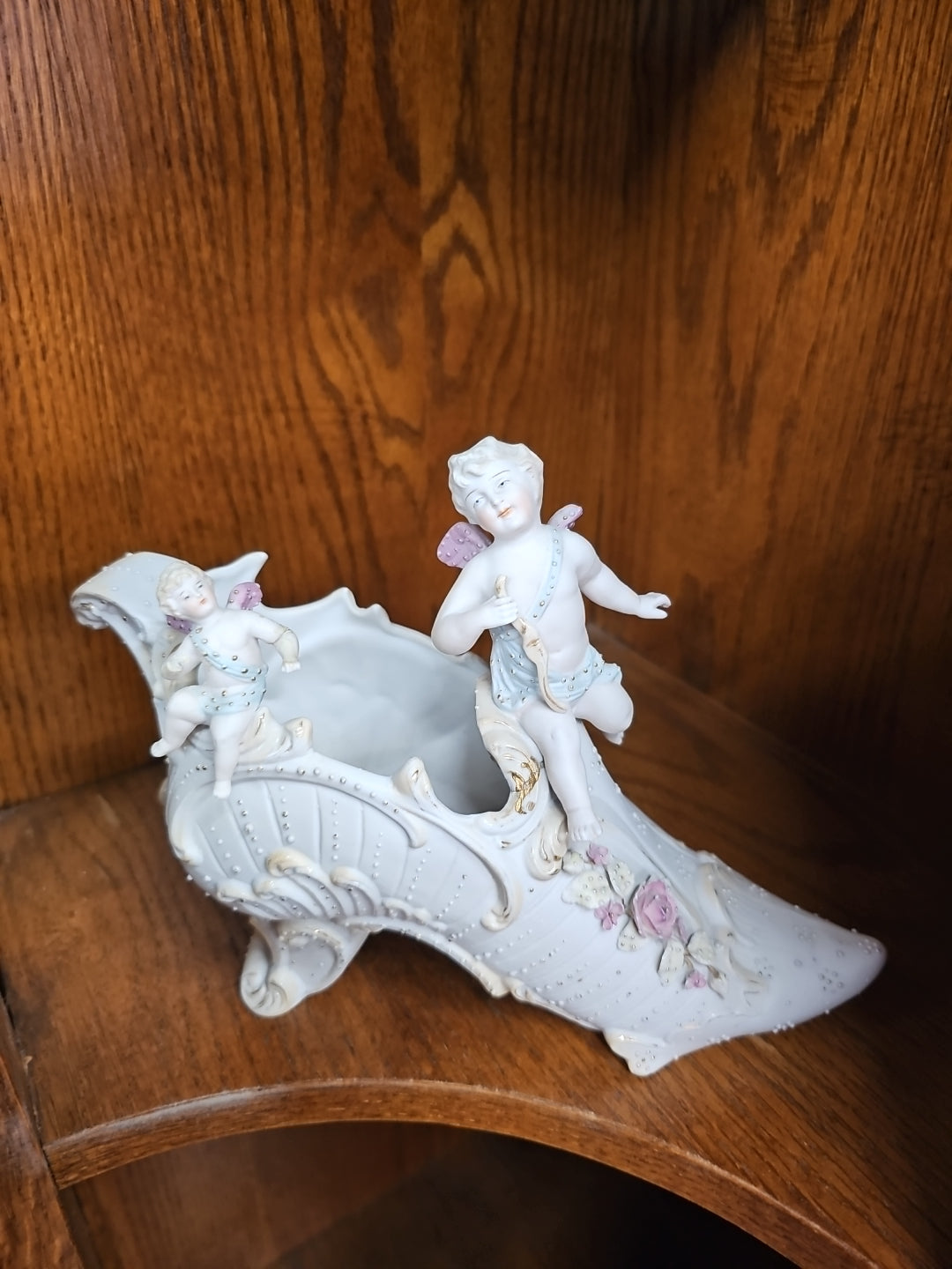 Antique German Bisque Angel figurine on a victorian shoe