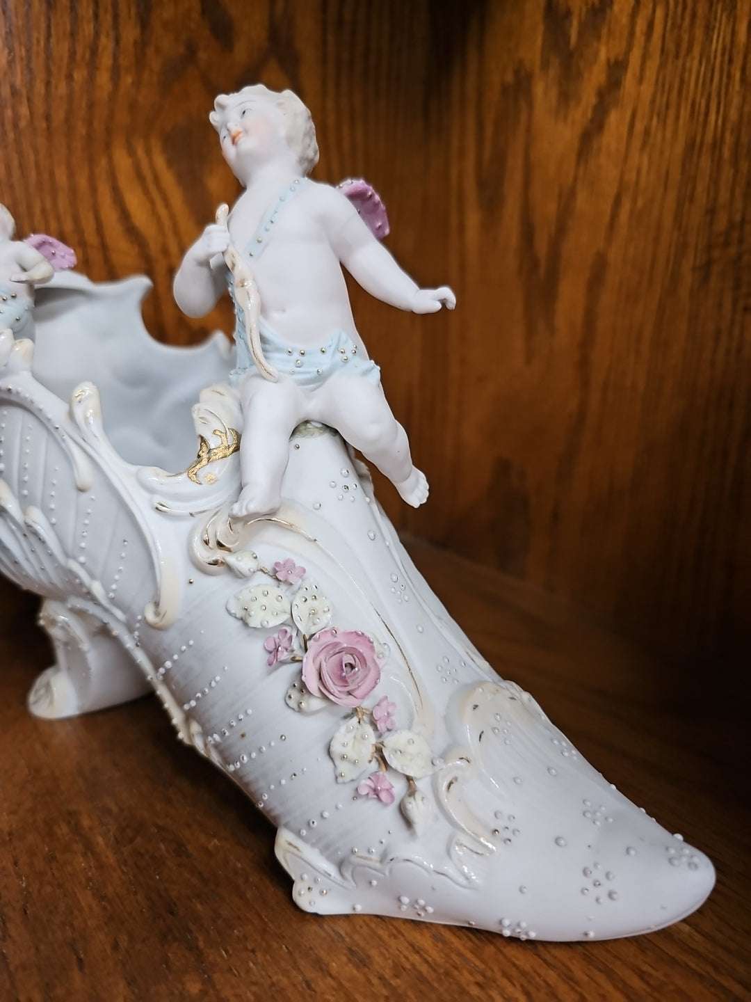 Antique German Bisque Angel figurine on a victorian shoe