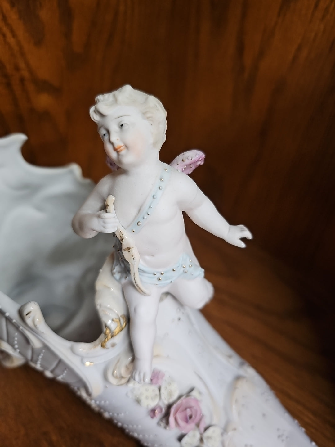 Antique German Bisque Angel figurine on a victorian shoe