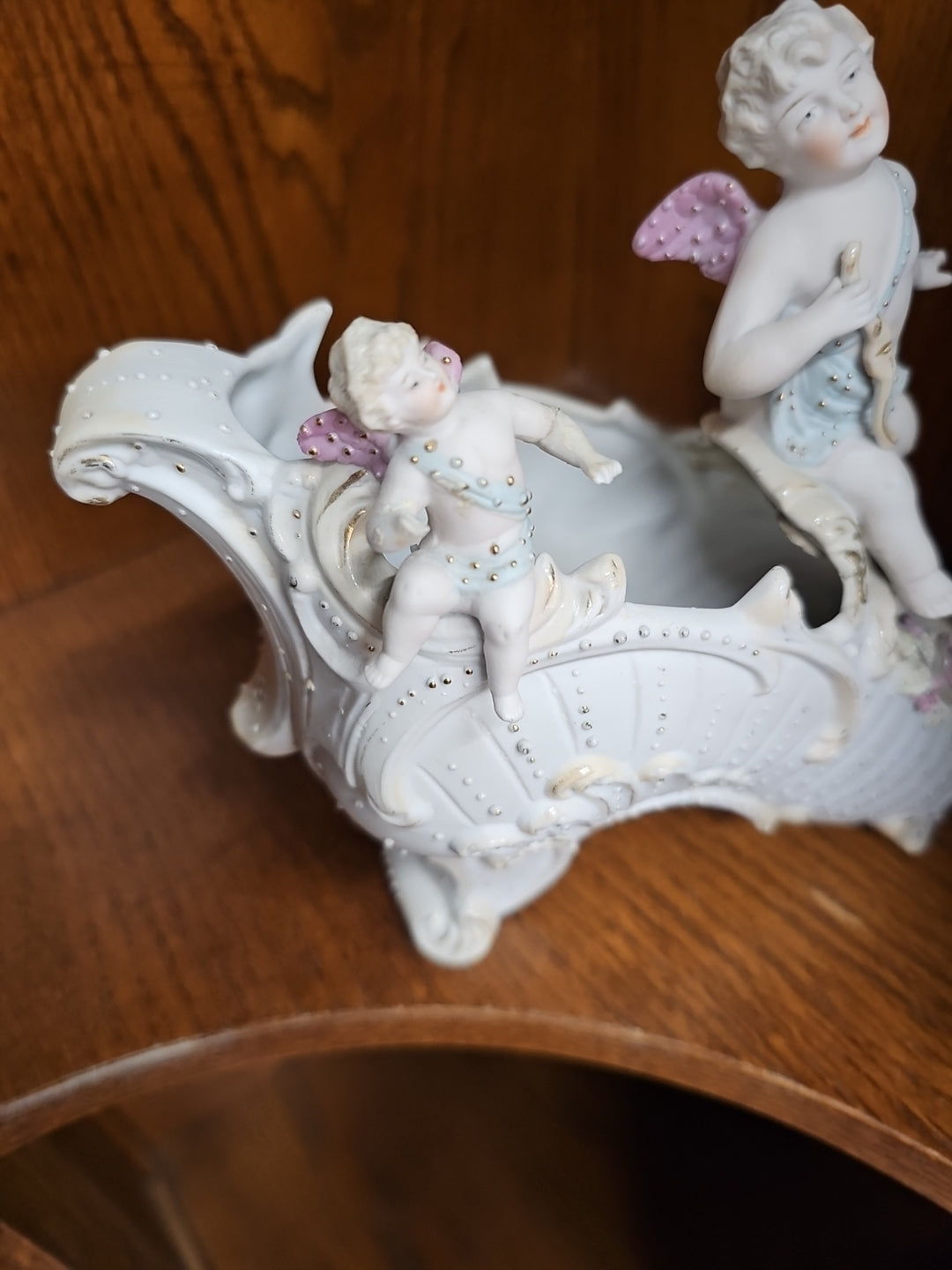 Antique German Bisque Angel figurine on a victorian shoe