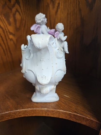 Antique German Bisque Angel figurine on a victorian shoe