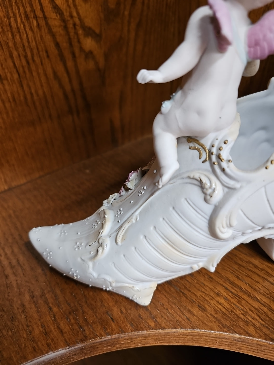 Antique German Bisque Angel figurine on a victorian shoe